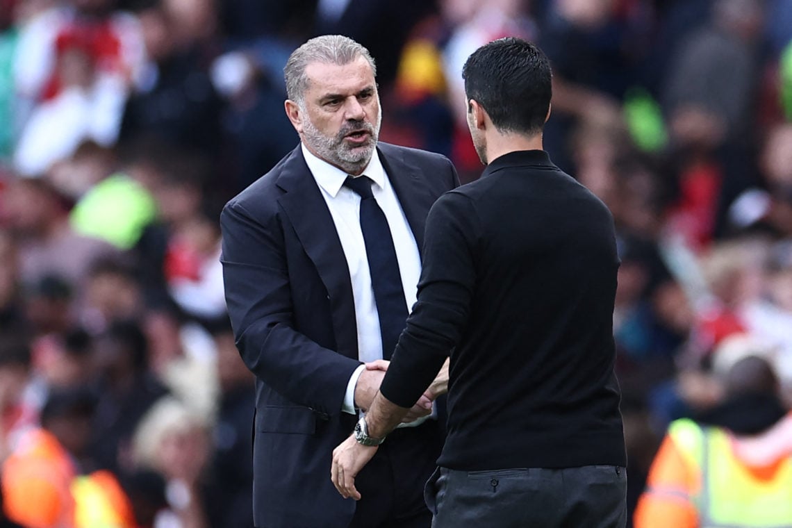 Tottenham Hotspur's Greek-Australian Head Coach Ange Postecoglou (L) shakes hands with Arsenal's Spanish manager Mikel Arteta (R) after the English...