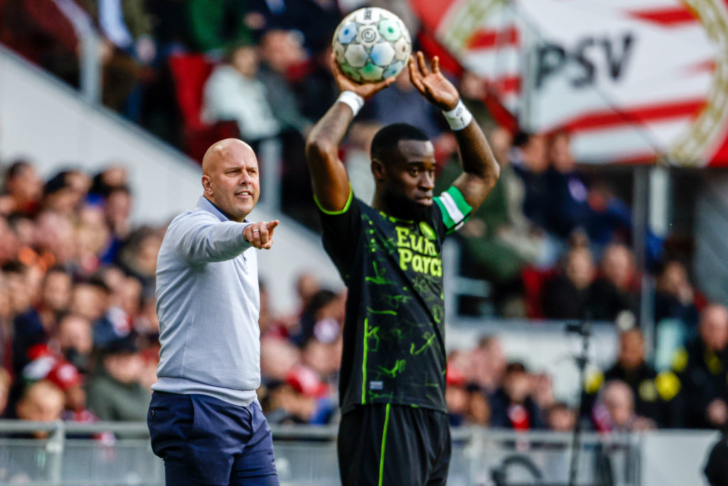 Head Coach Arne Slot of Feyenoord points with finger, Lutsharel Geertruida of Feyenoord throws a ball during the Dutch Eredivisie match between PSV...