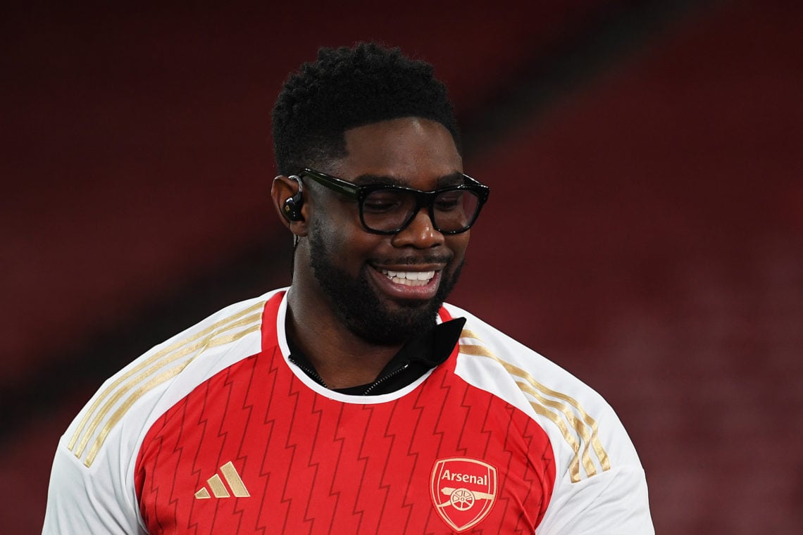 Micah Richards, former English football player and current TNT Sports pundit, wears an Arsenal shirt following the UEFA Champions League 2023/24 ro...
