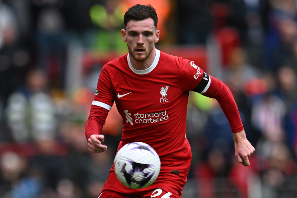 Liverpool's Scottish defender #26 Andrew Robertson runs with the ball during the English Premier League football match between Liverpool and Crysta...