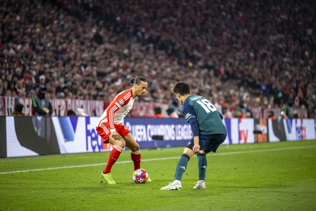 Leroy Sane of FC Bayern Muenchen and Takehiro Tomiyasu of Arsenal in action during the UEFA Champions League quarter-final second leg match between...