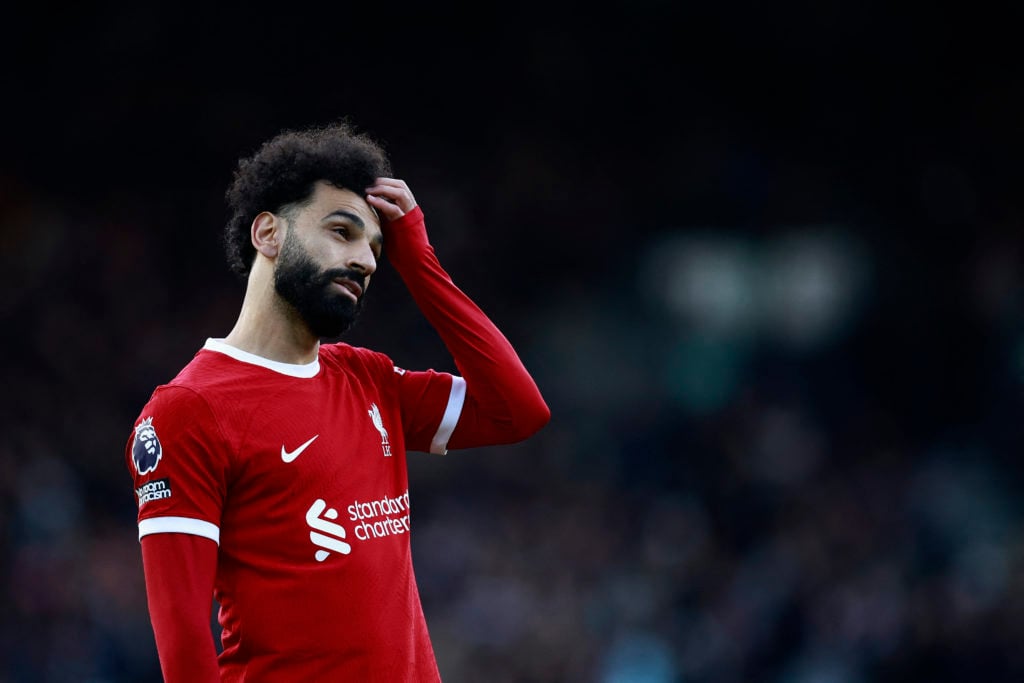 Liverpool's Egyptian striker #11 Mohamed Salah reacts during the English Premier League football match between Fulham and Liverpool at Craven Cotta...