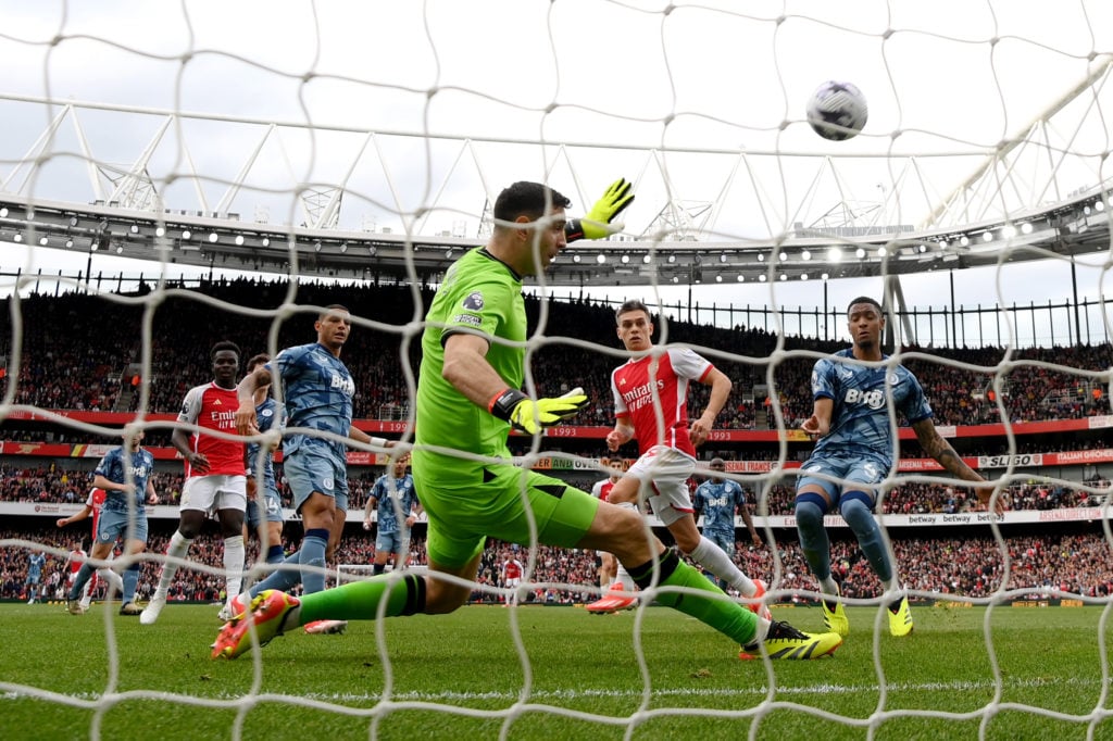 Emiliano Martinez of Aston Villa makes a save from Leandro Trossard of Arsenal during the Premier League match between Arsenal FC and Aston Villa a...