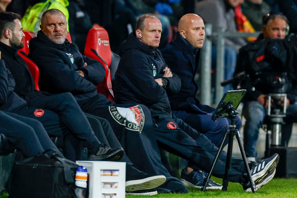 assistant coach John de Wolf of Feyenoord and assistant coach Sipke Hulshoff of Feyenoord and head coach Arne Slot of Feyenoord looks on during the...