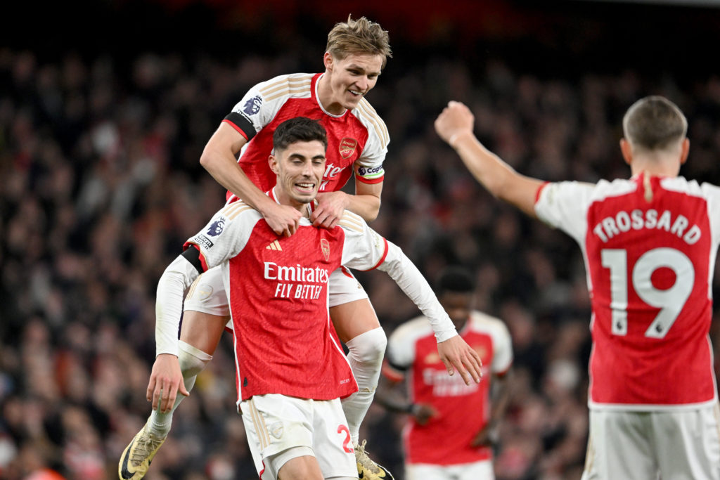 Kai Havertz of Arsenal celebrates scoring his team's fourth goal with teammate Martin Odegaard during the Premier League match between Arsenal FC a...