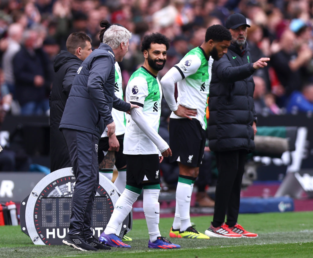 Manager of West Ham David Moyes and Mohamed Salah of Liverpool laugh during the Premier League match between West Ham United and Liverpool FC at Lo...