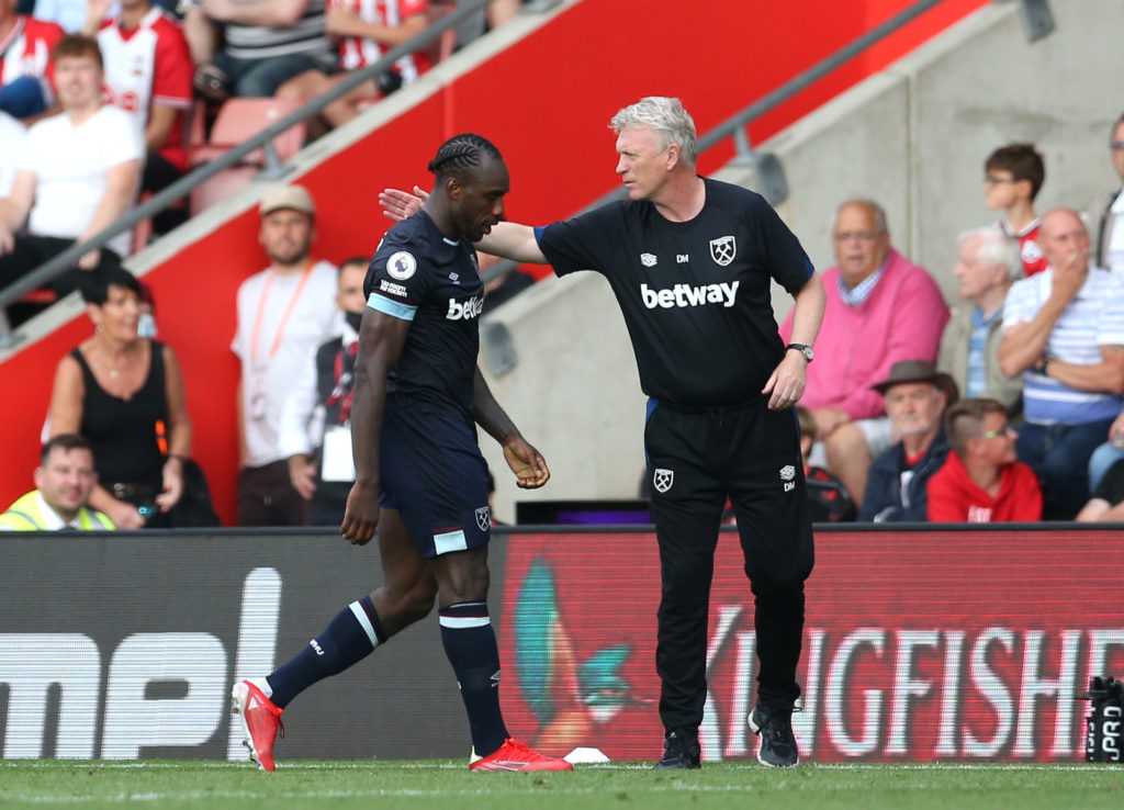 Michail Antonio of West Ham United is consoled by David Moyes, Manager of West Ham United after he is shown a red card during the Premier League ma...