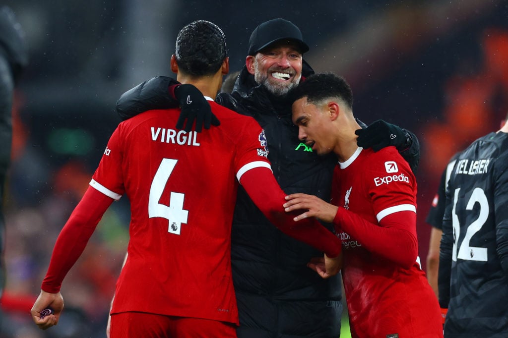 Liverpool manager Jurgen Klopp celebrates with Virgil van Djik and Trent Alexander-Arnold at full-time following the Premier League match between L...