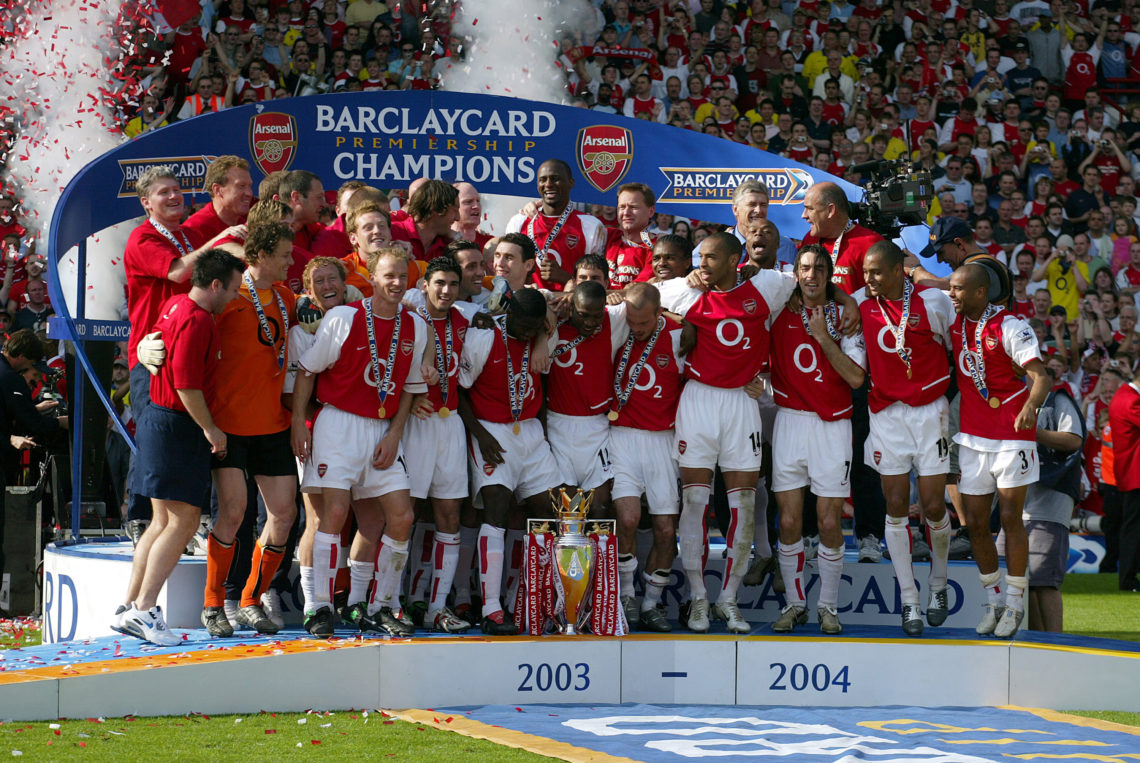 Arsenal players celebrate with Premiership trophy after becoming the 2003-2004 Premier League champions after winning the Premier League match betw...
