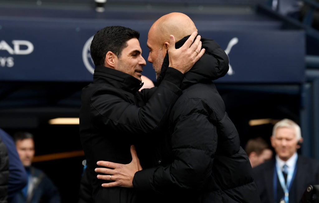 Mikel Arteta, Manager of Arsenal, interacts with Pep Guardiola, Manager of Manchester City, prior to the Premier League match between Manchester Ci...