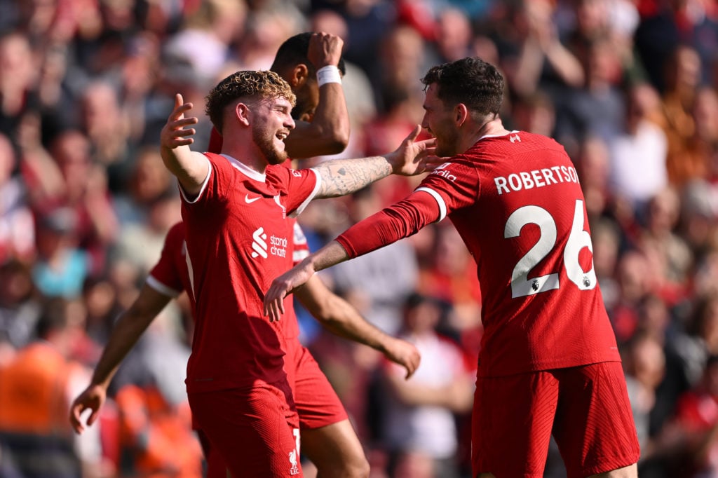 Andrew Robertson of Liverpool celebrates scoring his team's second goal with teammate Harvey Elliott during the Premier League match between Liverp...