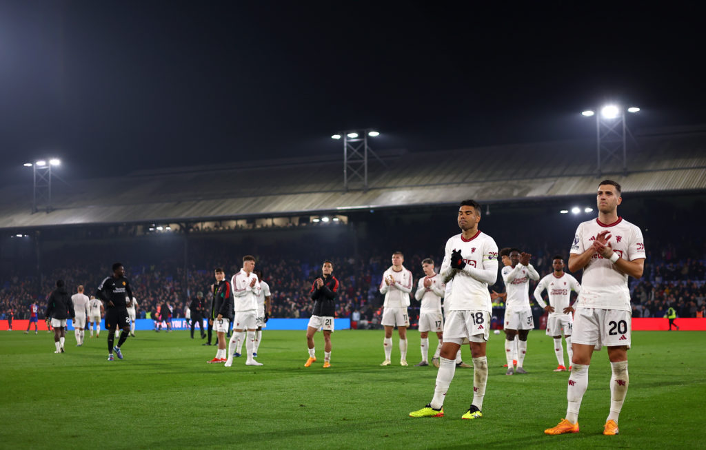 Casemiro and Diogo Dalot of Manchester United applaud the fans after the Premier League match between Crystal Palace and Manchester United at Selhu...