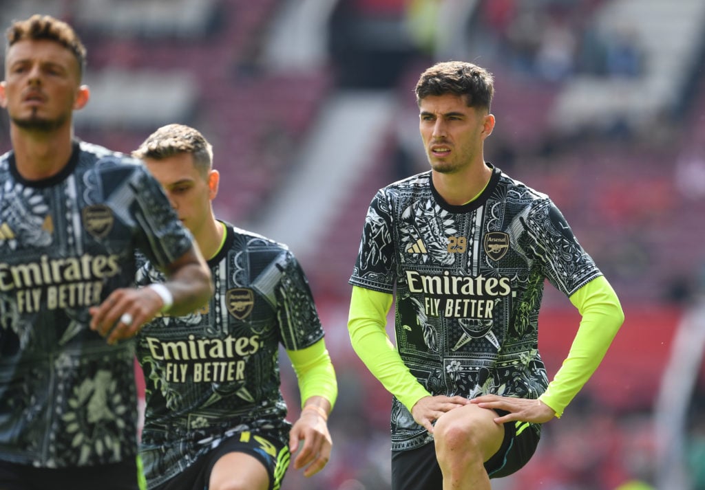 Kai Havertz of Arsenal looks on as he warms up with teammates prior to the Premier League match between Manchester United and Arsenal FC at Old Tra...