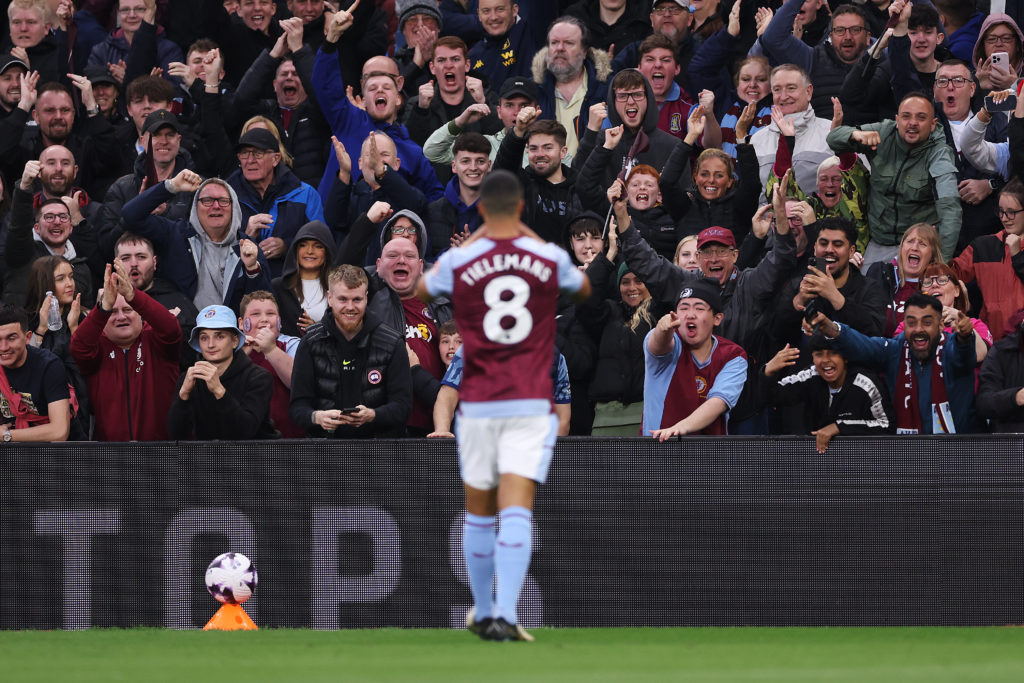 Youri Tielemans of Aston Villa (obscured) celebrates scoring his team's first goal with fans during the Premier League match between Aston Villa an...