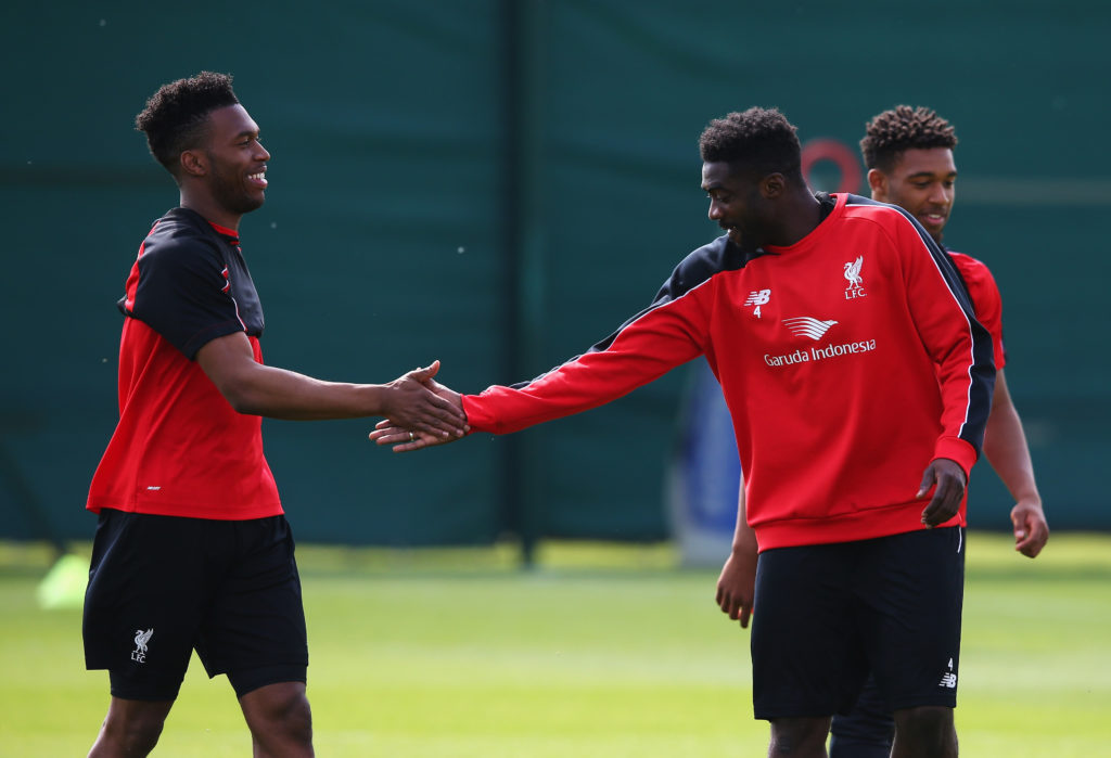 Daniel Sturridge and Kolo Toure of Liverpool shake hands during a training session at the Liverpool UEFA Europa League Cup Final Media Day at Melwo...