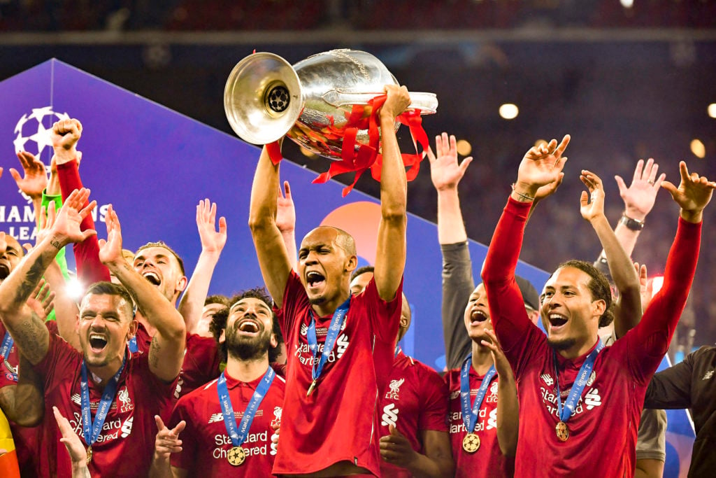 Fabinho of Liverpool FC lifts the trophy with his teammates as they celebrate winning the UEFA Champions League Final match between Tottenham Hotsp...