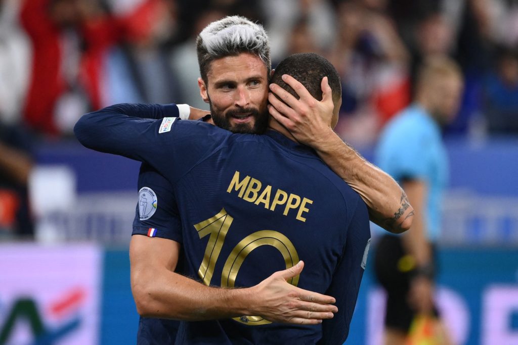 TOPSHOT - France's forward Olivier Giroud (L) embraces teammate France's forward Kylian Mbappe after scoring during the UEFA Nations League, League...