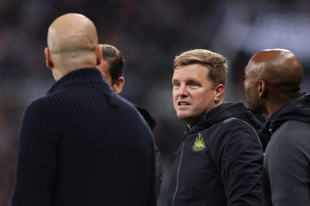 Eddie Howe, Manager of Newcastle United, speaks to Pep Guardiola, Manager of Manchester City, during the Carabao Cup Third Round match between Newc...