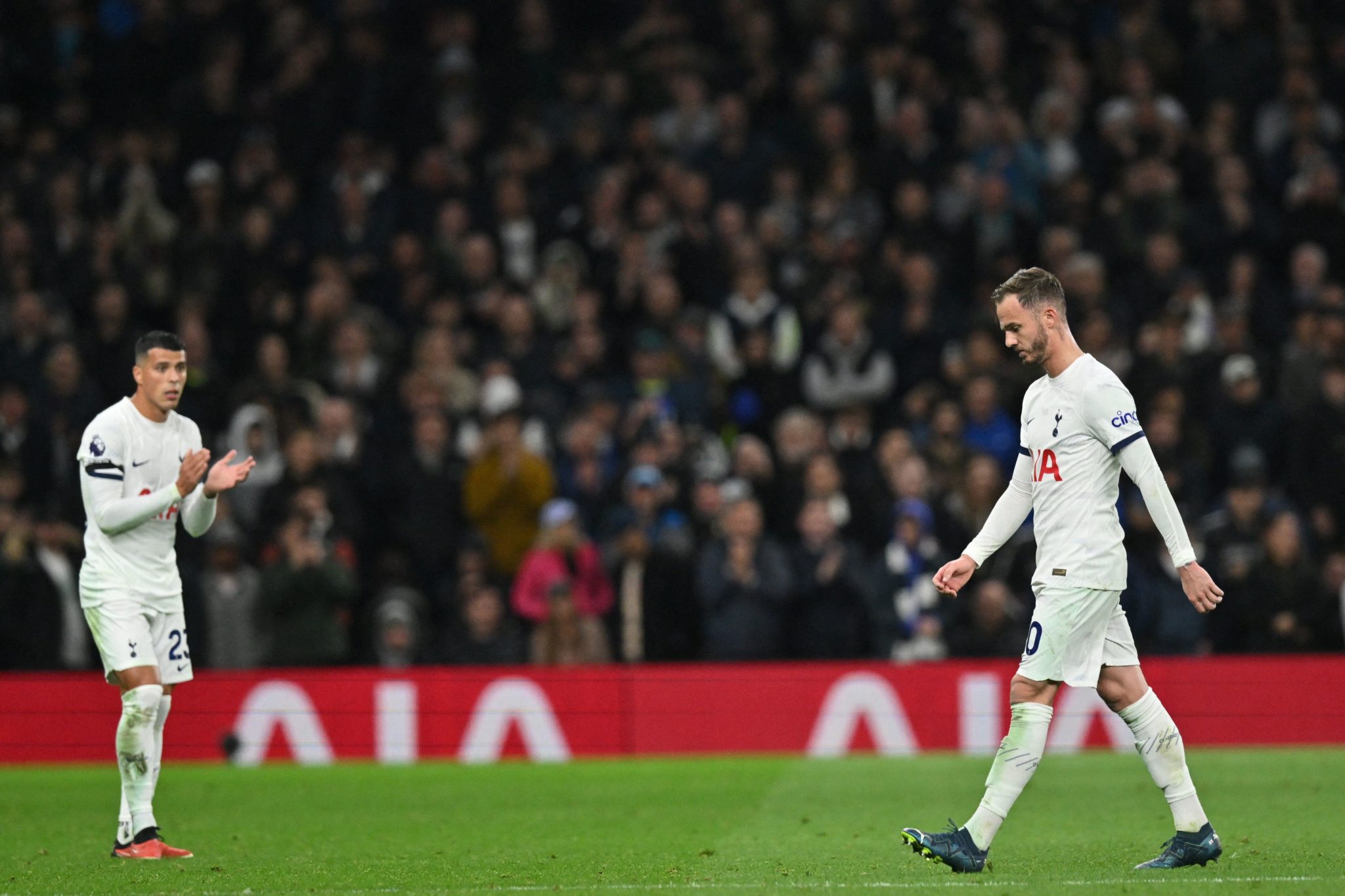 Jude Bellingham and Tottenham's Pedro Porro react after James Maddison ...