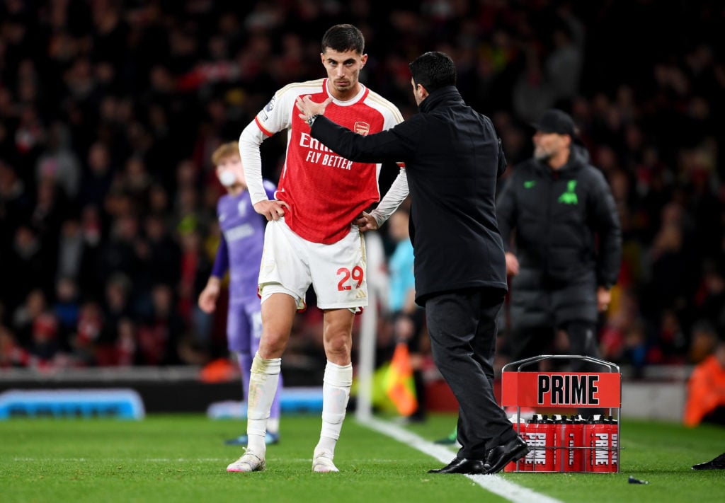 Kai Havertz of Arsenal receives instructions from Mikel Arteta, Manager of Arsenal, during the Premier League match between Arsenal FC and Liverpoo...
