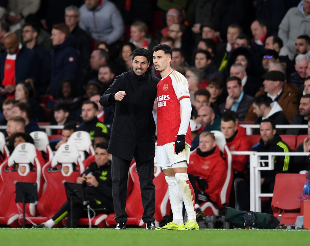 Mikel Arteta the Arsenal Manager chats to Gabriel Martinelli of Arsenal during the Premier League match between Arsenal FC and Liverpool FC at Emir...
