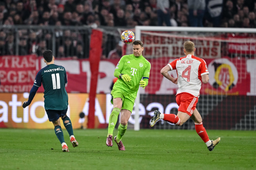 Gabriel Martinelli of Arsenal FC, goalkeeper Manuel Neuer of Bayern Muenchen and Matthijs de Ligt of Bayern Muenchen battle for the ball during the...