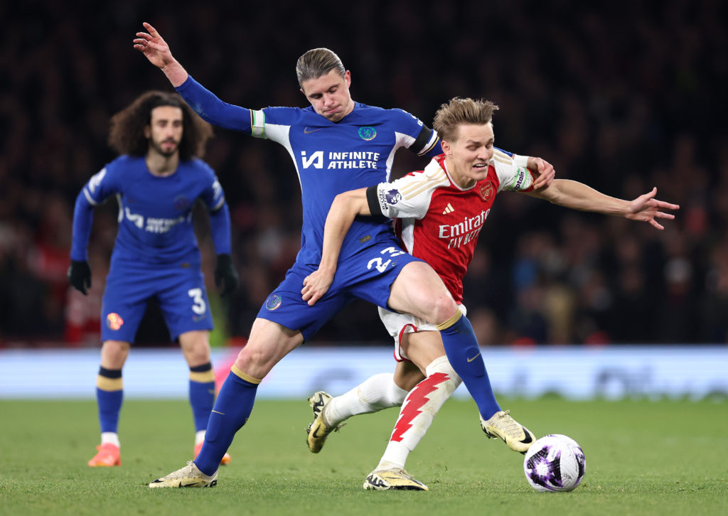 Conor Gallagher of Chelsea tackles Martin Odegaard of Arsenal during the Premier League match between Arsenal FC and Chelsea FC at Emirates Stadium...