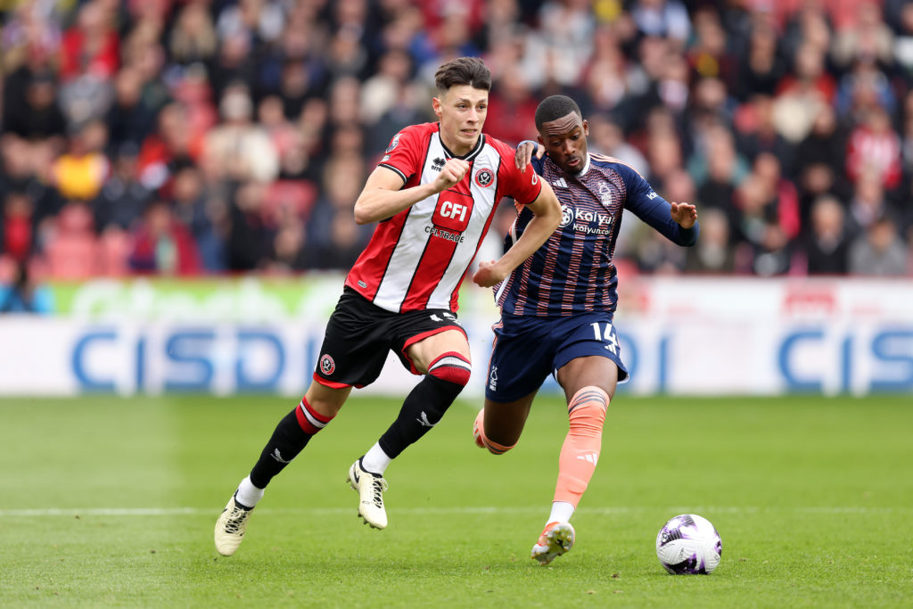 Anel Ahmedhodzic of Sheffield United runs with the ball whilst under pressure from Callum Hudson-Odoi of Nottingham Forest during the Premier Leagu...