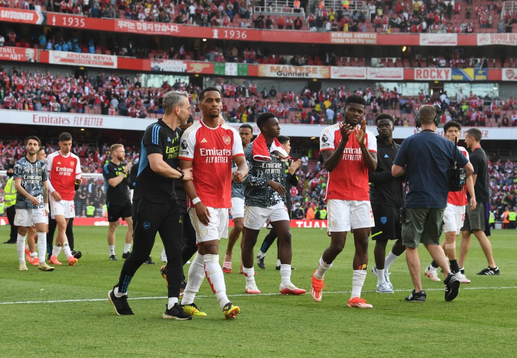 Albert Stuivenberg the Arsenal Coach chats to Jurrien Timber of Arsenal after the Premier League match between Arsenal FC and Everton FC at Emirate...