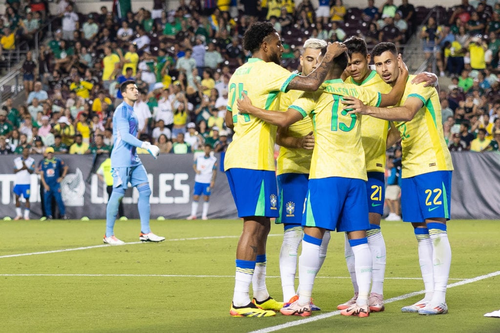 Brazil's forward #22 Gabriel Martinelli (R) celebrates scoring his team's second goal with teammates during the international friendly football mat...