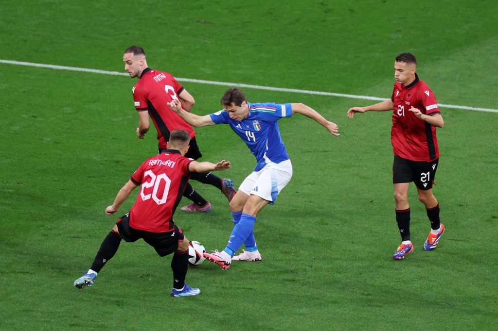 Federico Chiesa of Italy shoots under pressure from Ylber Ramadani of Albania during the UEFA EURO 2024 group stage match between Italy and Albania...