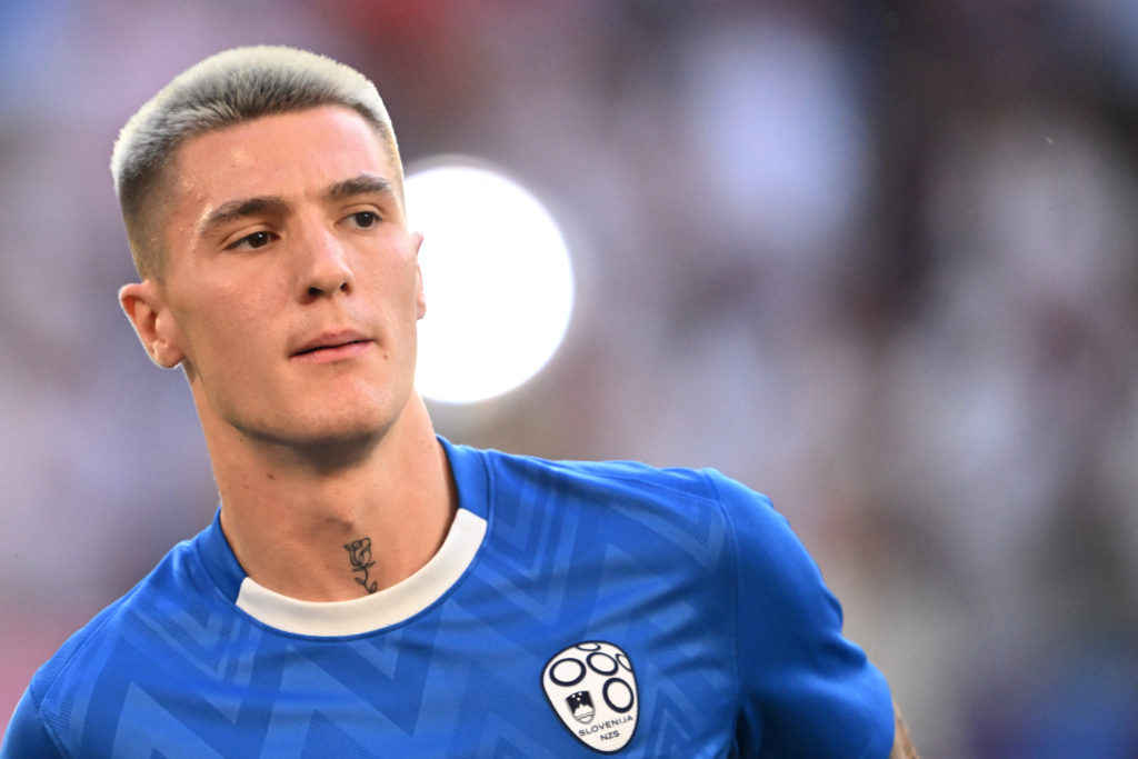 Benjamin Sesko warms up before the UEFA Euro 2024 Group C football match between England and Slovenia at the Cologne Stadium in Cologne on June 25, 2024.