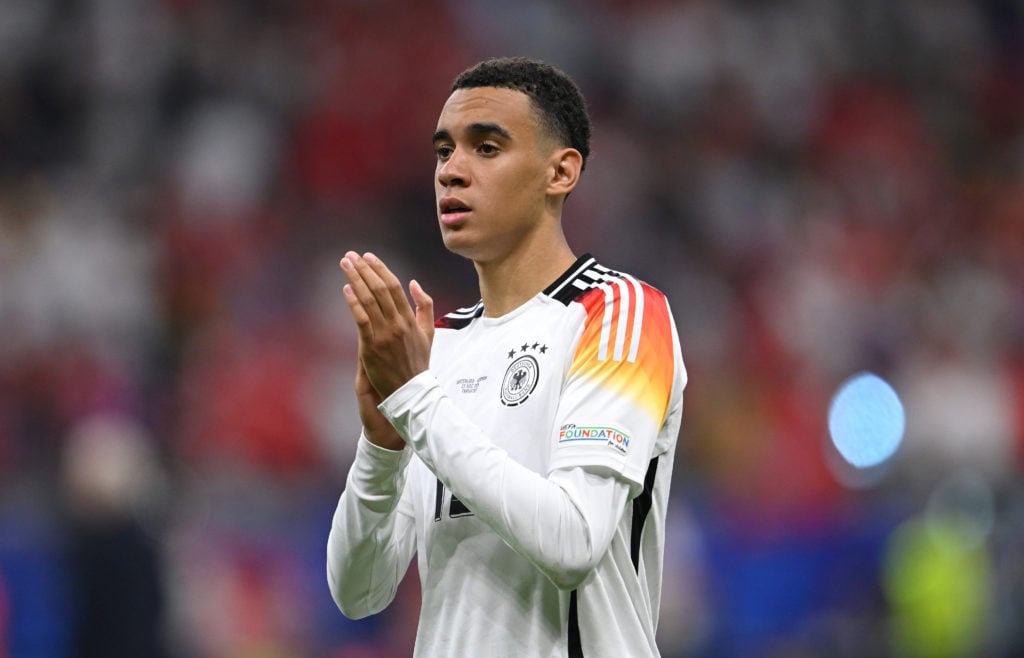 Jamal Musiala of Germany applauds the fans after the UEFA EURO 2024 group stage match between Switzerland and Germany at Frankfurt Arena on June 23...