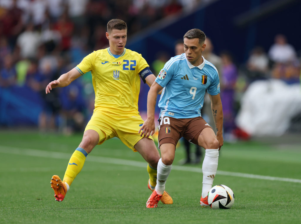 Leandro Trossard of Belgium controls the ball whilst under pressure from Mykola Matviyenko of Ukraine during the UEFA EURO 2024 group stage match b...