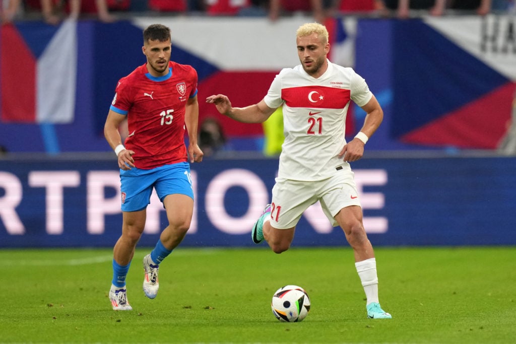 (L-R) Czech Republic's David Jurasek  and Baris Alper Yilmaz fight for the ball during the UEFA EURO 2024 group stage match between Czechia and Tur...