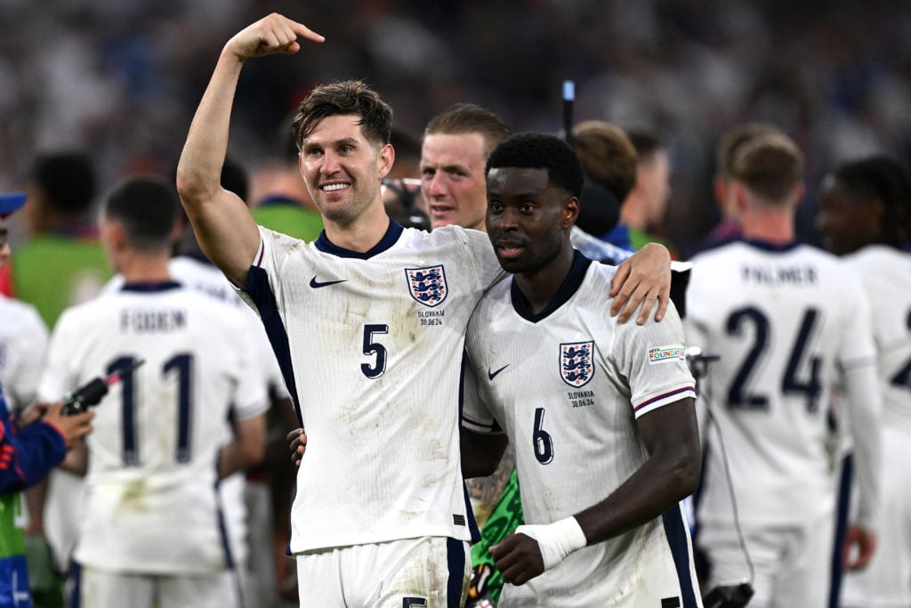 John Stones and Marc Guehi of England celebrate win at the end of the UEFA EURO 2024 round of 16 match between England and Slovakia at Arena AufSch...