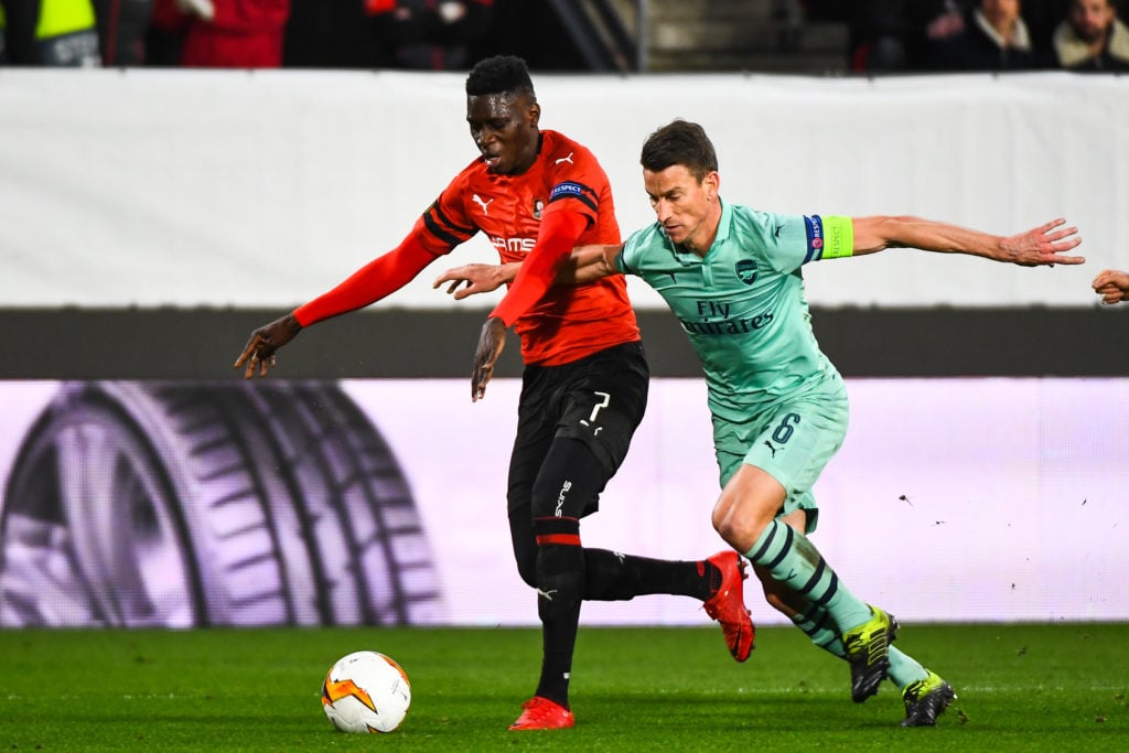 Ismaila Sarr of Rennes and Laurent Koscielny of Arsenal during the UEFA Europa League 2018/19 Round of 16 First Leg match between Rennes and Arsena...