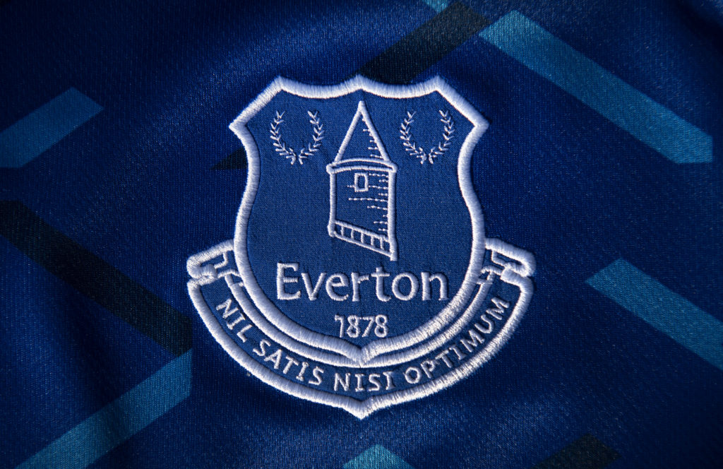 The Everton club crest on their first team home shirt on May 14, 2020 in Manchester, England.