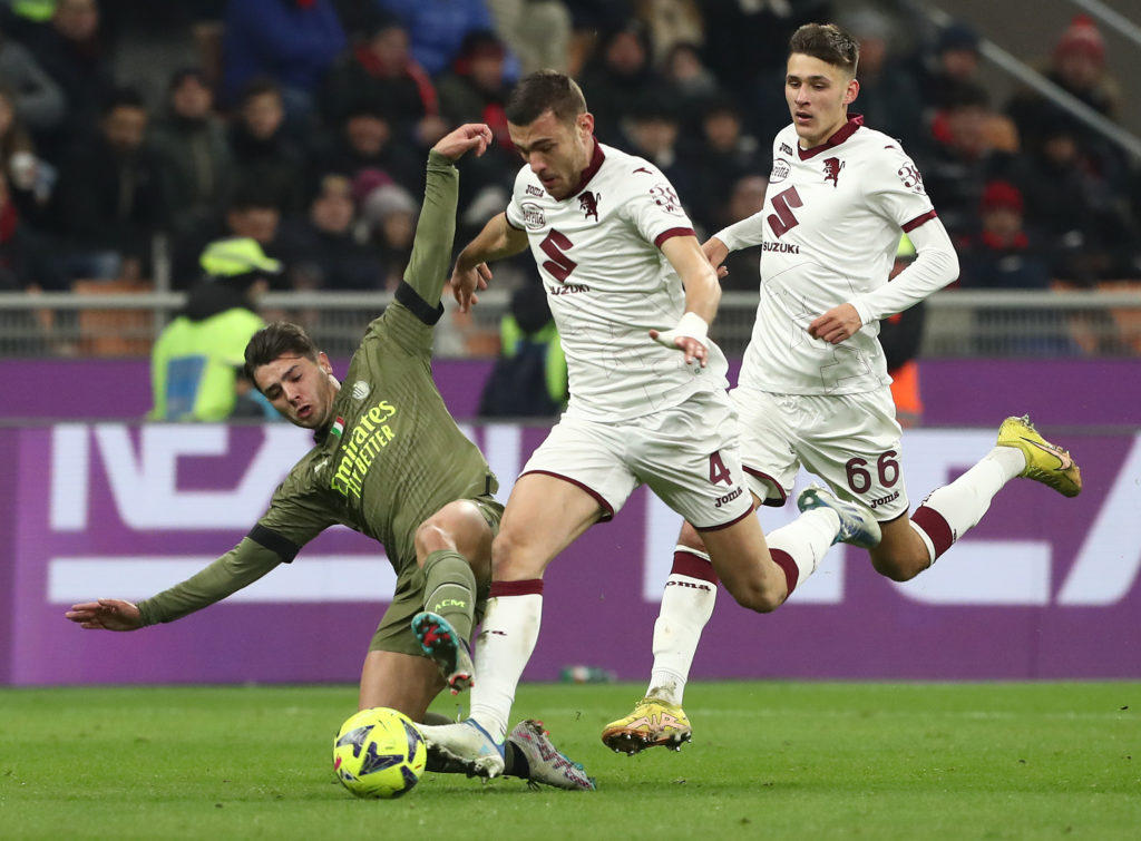 Brahim Díazof AC Milan is challenged by Alessandro Buongiorno of Torino during the Serie A match between AC MIlan and Torino FC at Stadio Giuseppe ...