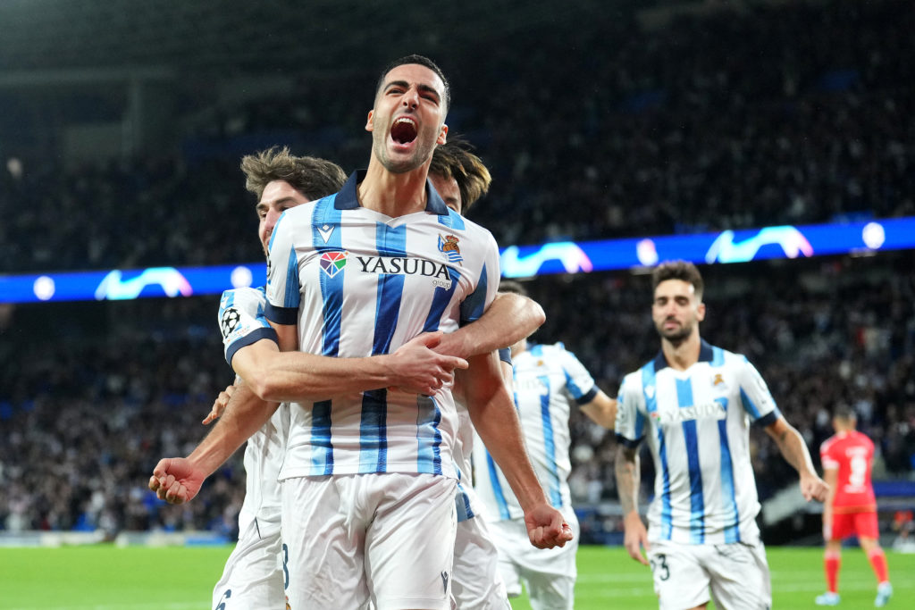 Mikel Merino of Real Sociedad celebrates with teammates after scoring the team's first goal during the UEFA Champions League match between Real Soc...