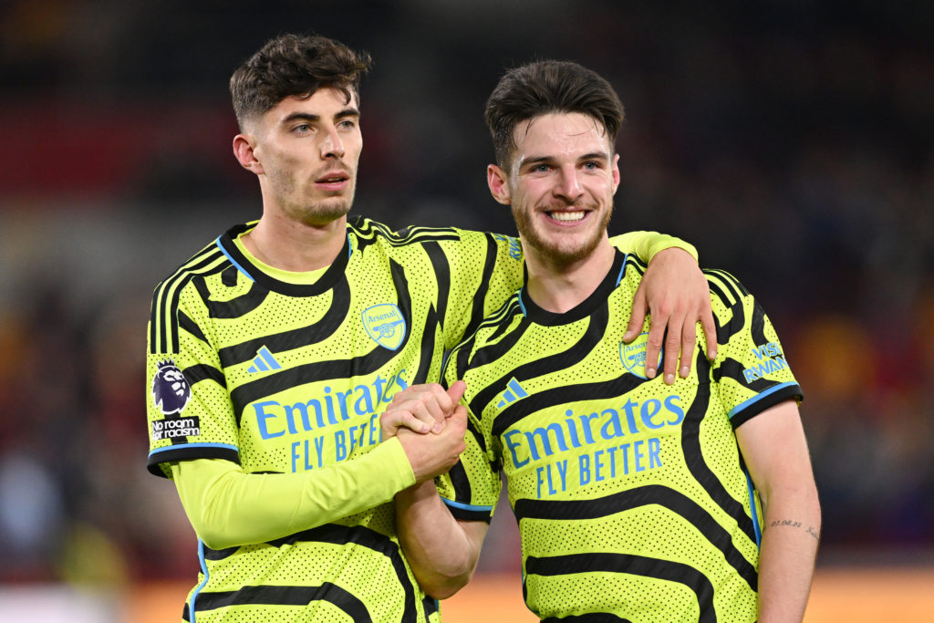 Kai Havertz of Arsenal celebrates with teammate Declan Rice following the team's victory during the Premier League match between Brentford FC and A...