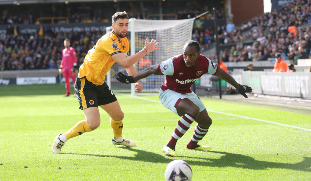 West Ham United's Michail Antonio and Wolverhampton Wanderers' Max Kilman during the Premier League match between Wolverhampton Wanderers and West ...