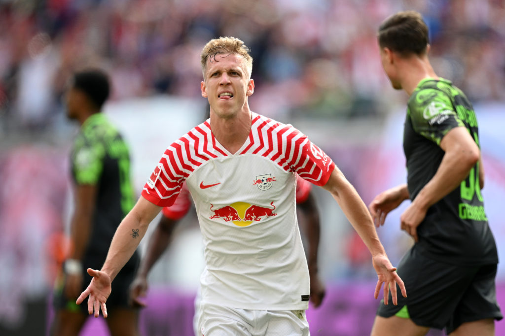 Dani Olmo of RB Leipzig celebrates scoring his team's first goal during the Bundesliga match between RB Leipzig and VfL Wolfsburg at Red Bull Arena...