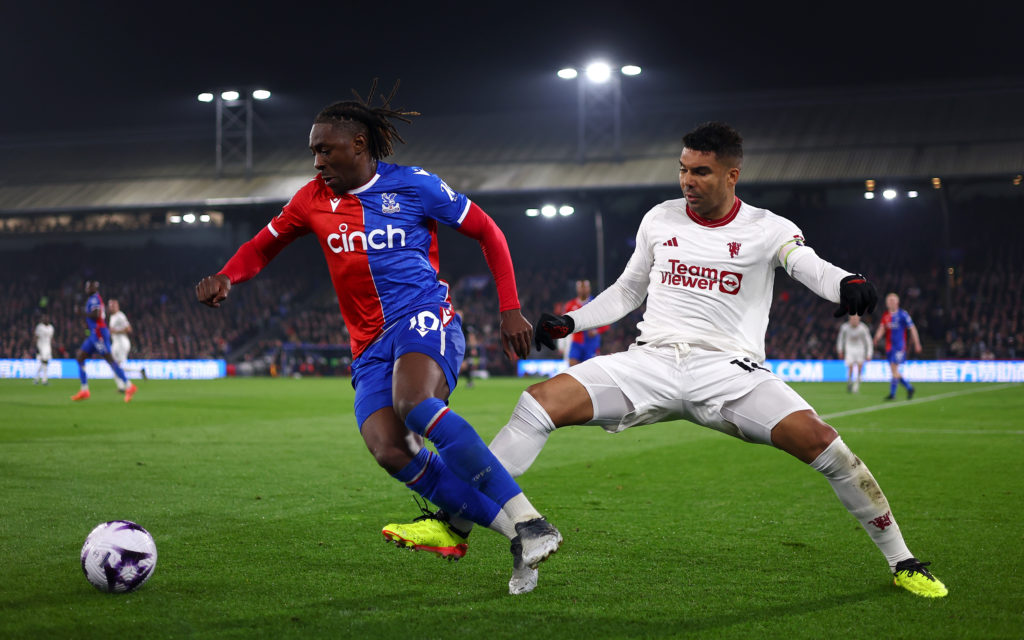 Eberchi Eze of Crystal Palace and Casemiro of Manchester United in action  during the Premier League match between Crystal Palace and Manchester Un...