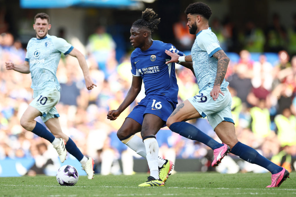 Chelsea's French midfielder #16 Lesley Ugochukwu (C) runs with the ball against Bournemouth's Danish midfielder #29 Philip Billing (R) during the E...