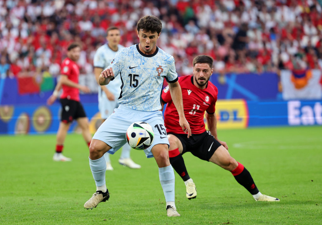 Joao Neves of Portugal looks to control the ball whilst under pressure from Otar Kiteishvili of Georgia during the UEFA EURO 2024 group stage match...