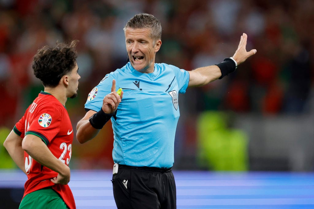 (L-R) Vitinha of Portugal argues with referee Daniele Orsato during the  EURO match between Portugal  v Slovenia at the Frankfurt arena on July 1, ...