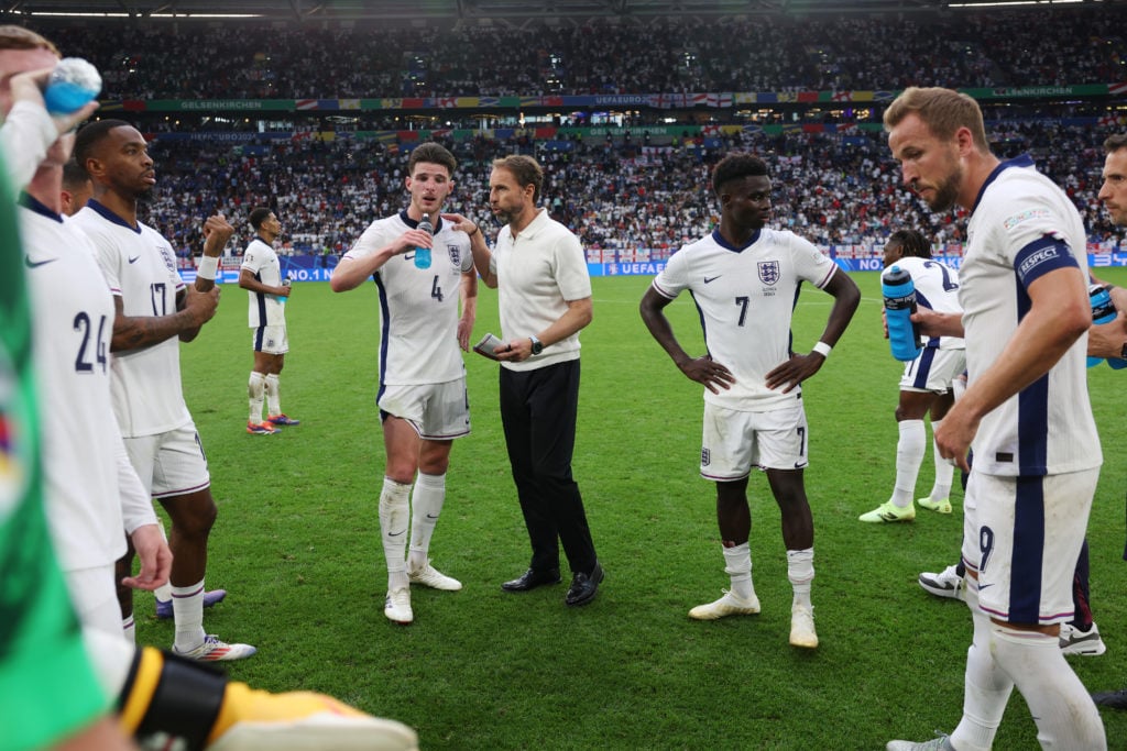 Gareth Southgate, Manager of England men's senior team, gives instructions to Declan Rice during half time of extra-time during the UEFA EURO 2024 ...