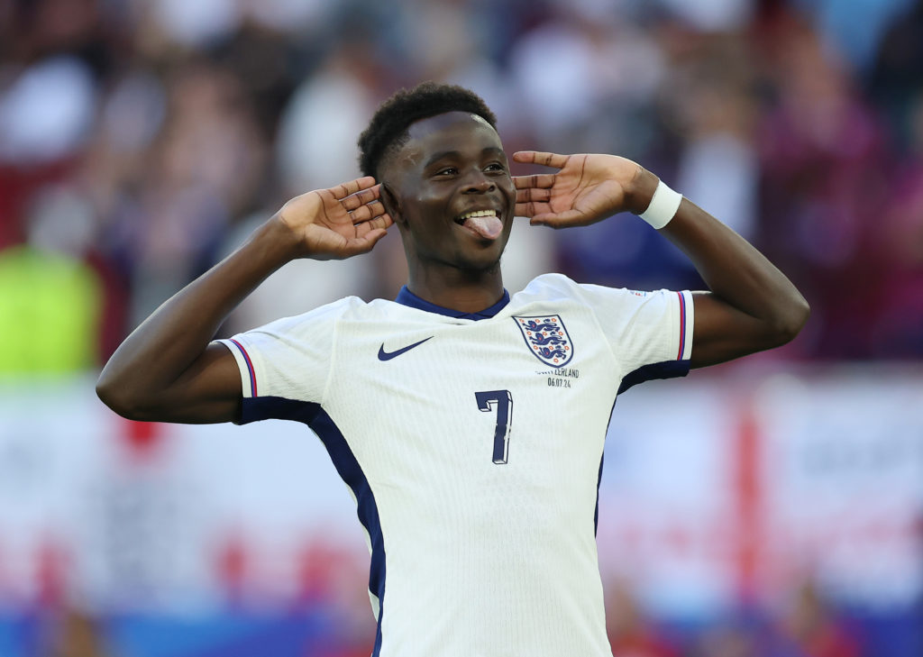 Bukayo Saka of England celebrates scoring the team's third penalty in the penalty shoot out during the UEFA EURO 2024 quarter-final match between E...