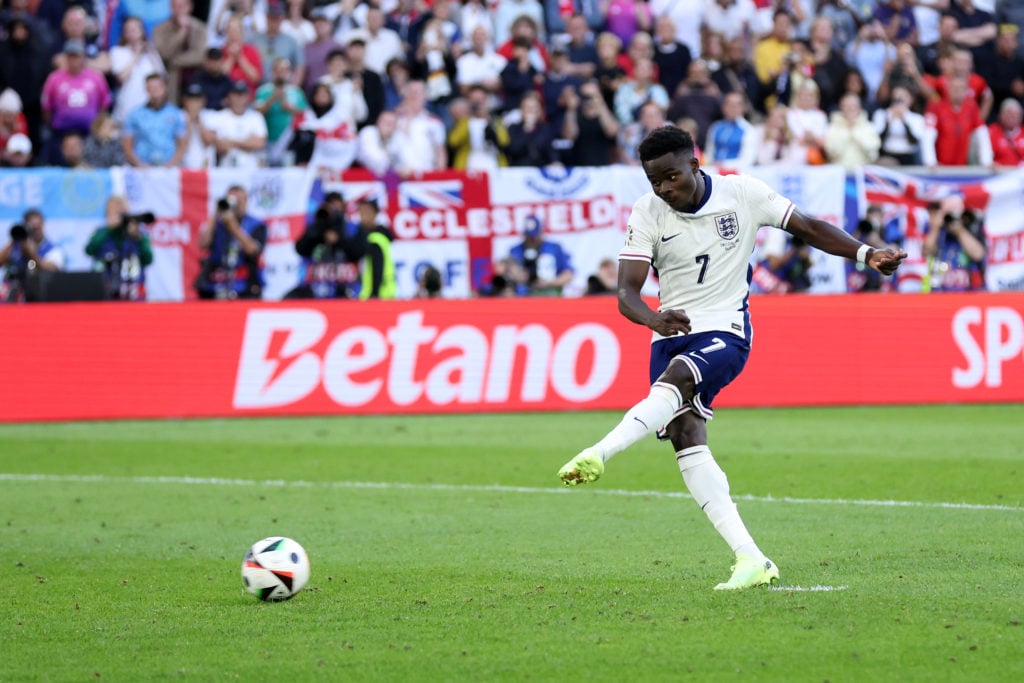 Bukayo Saka of England scores the team's third penalty in the penalty shoot out during the UEFA EURO 2024 quarter-final match between England and S...